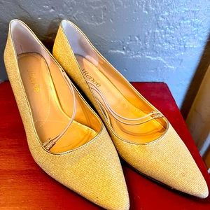 Gold kitten heel shoes.